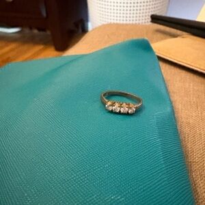 Vintage Gold Tone Ring with 4 clear stones. SZ9. Good condition. NO RETURNS.